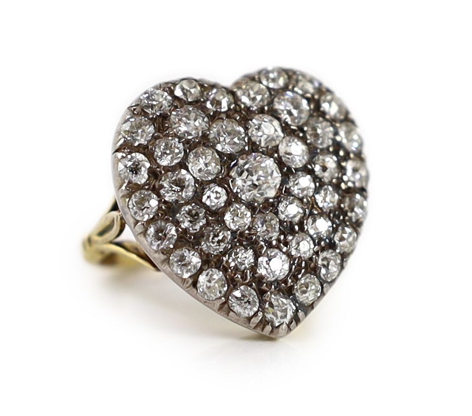 PROPERTY FROM THE COLLECTION OF HER ROYAL HIGHNESS THE PRINCESS MARGARET COUNTESS OF SNOWDON: An antique gold, silver and pave set diamond heart shaped dress ring